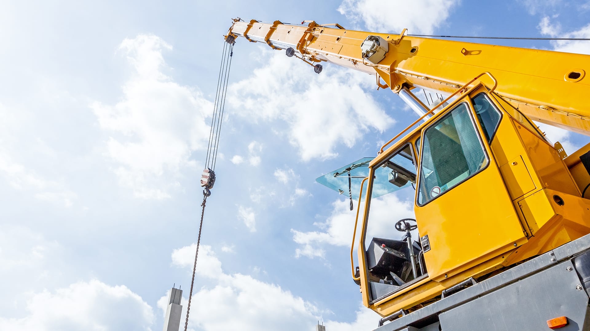 Large yellow crane- causes of crane tip-overs