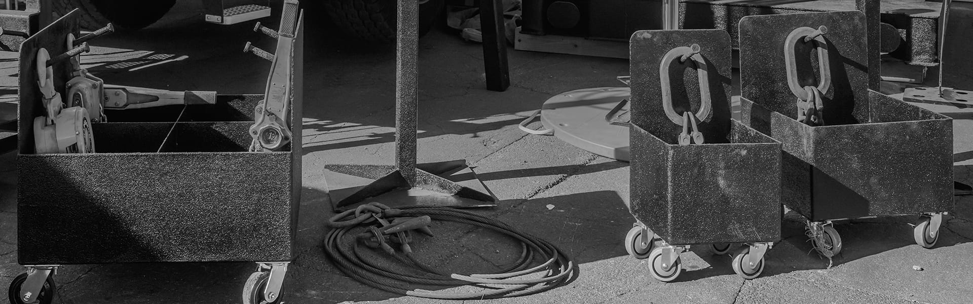 Steel Chain Caddies at Bigfoot Outrigger Pads in gray scale